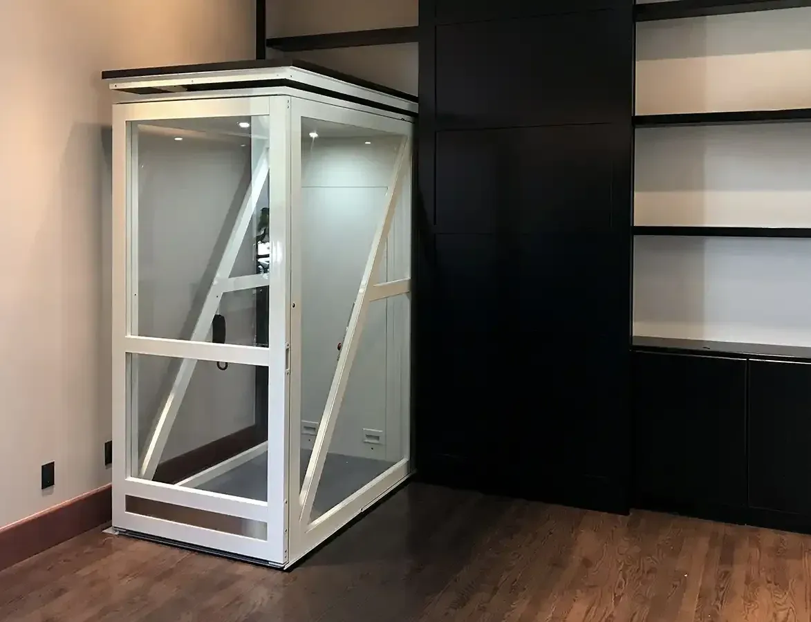 A Savaria Telecab 17 through-floor lift installed in a home living space